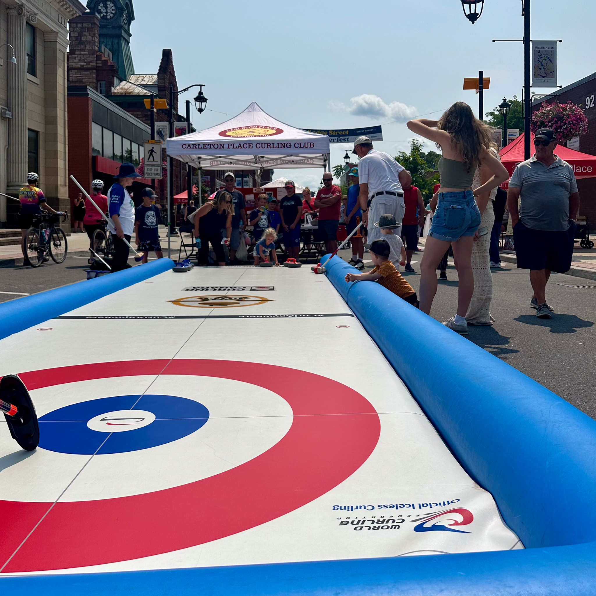 An inflatable curling rink at Summerfest
