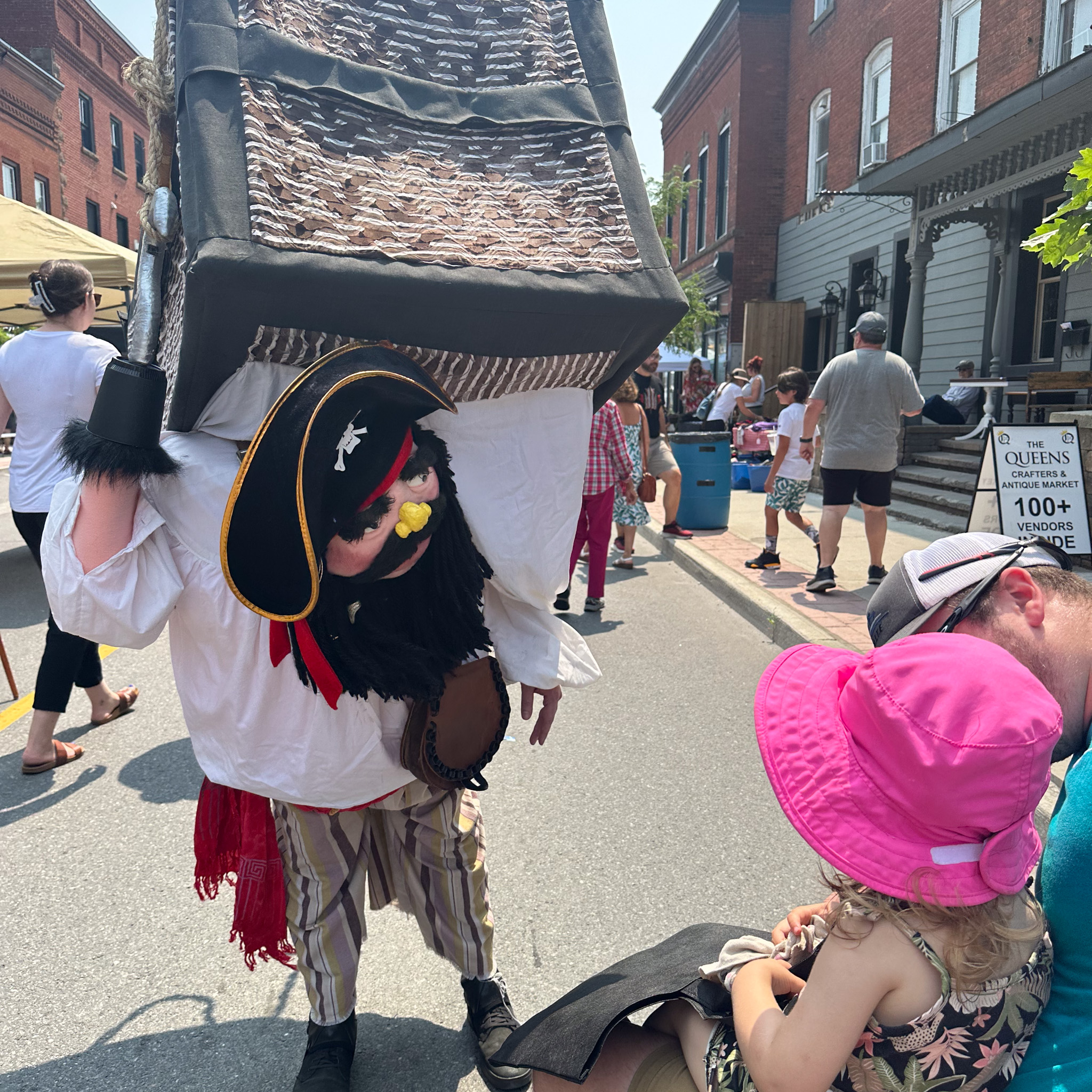 Large pirate puppet entertains father and child