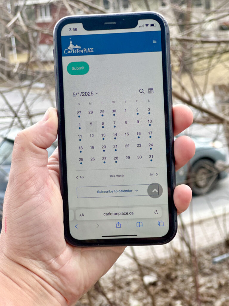 Cell phone displaying the community calendar