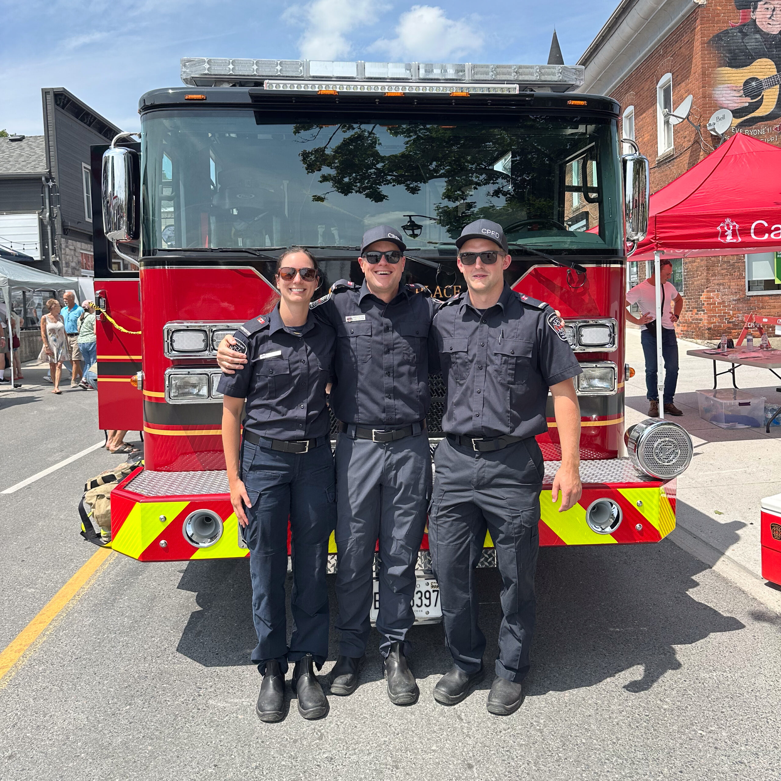 3 Members of the Carleton Place Fire Dept. Standing in front of a truck at Summerfest 2025